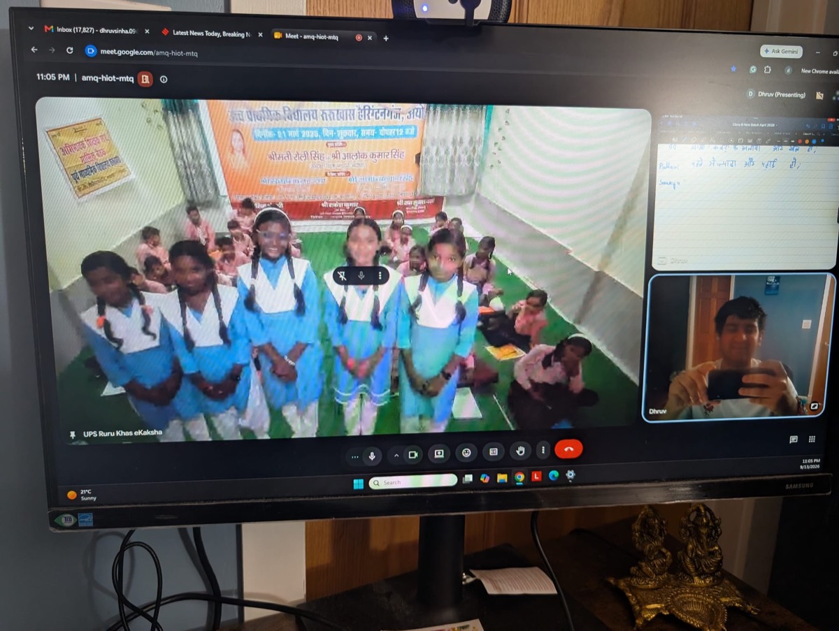 Students in blue uniforms standing in front of the camera during a virtual class